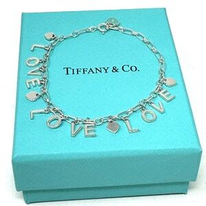Authentic Tiffany & co. Love Notes Charm Bracelet.